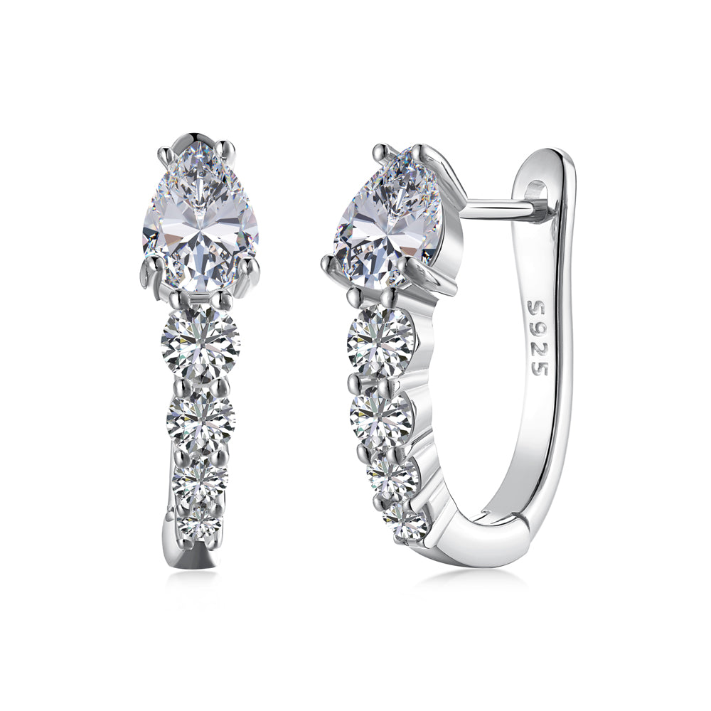 Silver earrings with clear gemstones on a white background