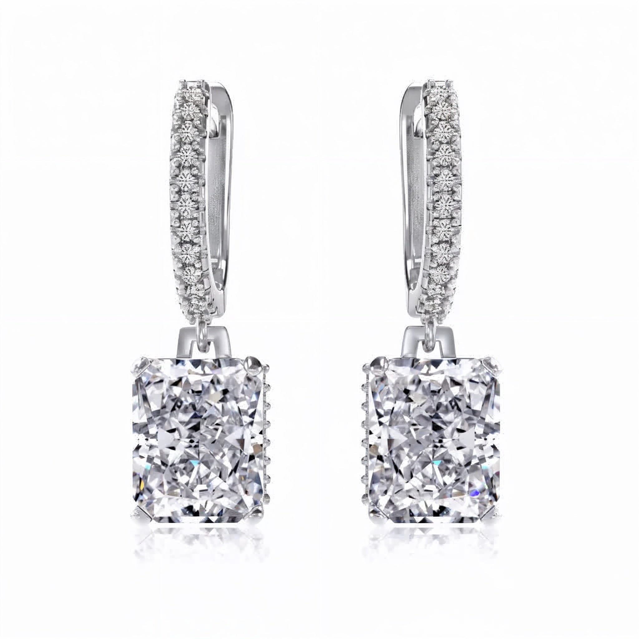 Pair of diamond earrings on a white background