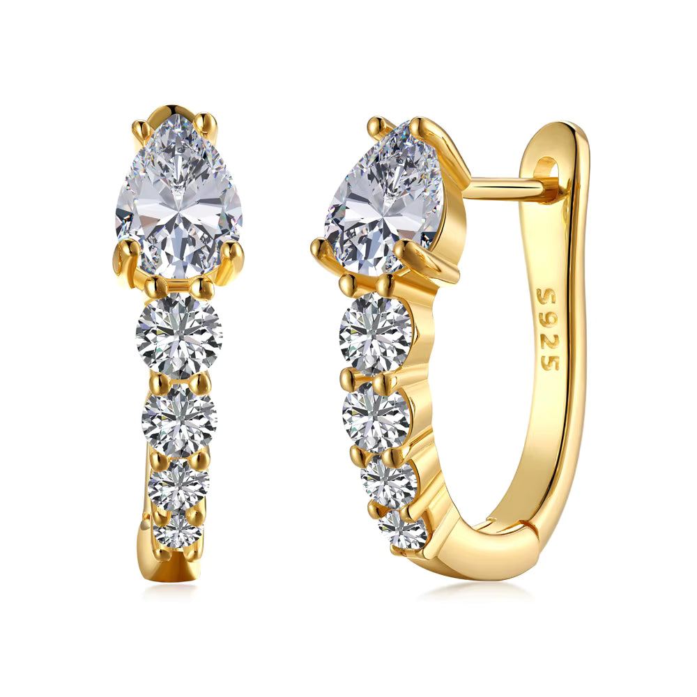 Gold hoop earrings with clear gemstones on a white background